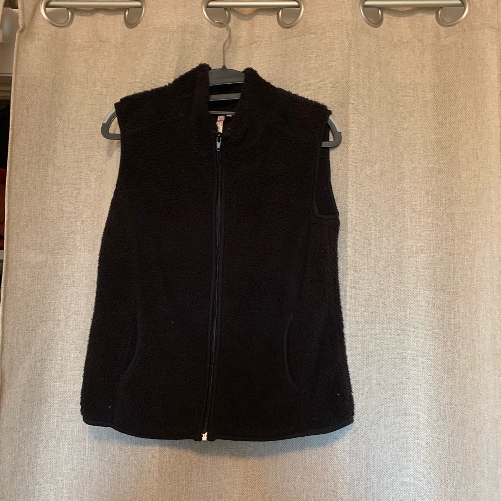 Black fuzzy vest.